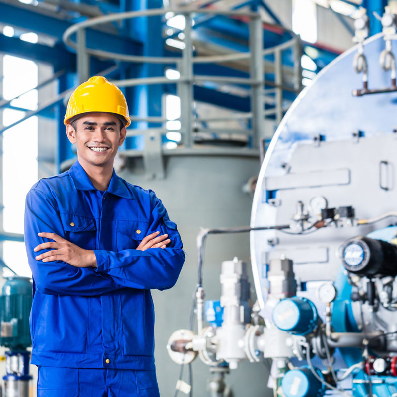 37846424 - Proud Asian Worker Standing In Production Factory